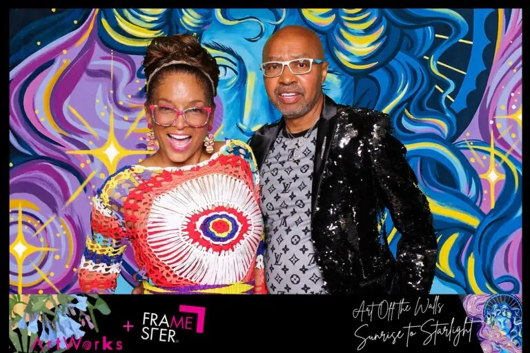Couple smiling in front of a digital green screen background for a Framester Open Air Photo Booth during ArtWorks Cincinnati annual fundraiser